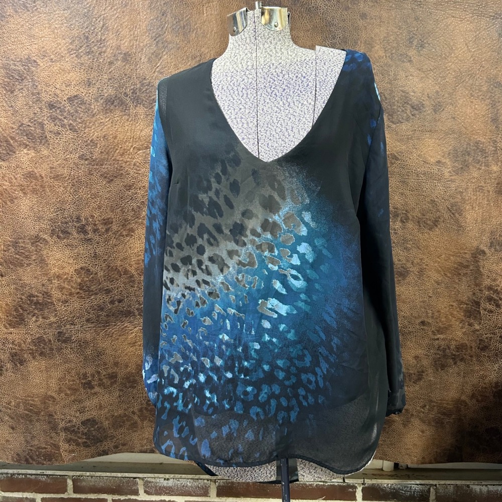 Juicy Couture lined sheer sleeve high low blouse in‎ blues on black. Size Large